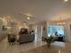 Open-concept living room with access to the dining area and outdoor patio at 216 Boxwood Dr, Davenport, FL 33837