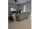 Comfortable living room with neutral tones, tile floors, and a view of the backyard at 216 Boxwood Dr, Davenport, FL 33837