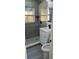 Bathroom with tiled shower, vanity, mirror, and toilet at 217 W Chelsea St, Deland, FL 32720