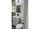 Bathroom showcasing a vanity with a granite countertop and a framed mirror at 217 W Chelsea St, Deland, FL 32720