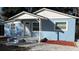 Charming blue exterior with a covered entryway and newly landscaped front yard offers great curb appeal at 217 W Chelsea St, Deland, FL 32720