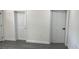 Bright interior with neutral paint and laminate flooring with doors providing access to rooms at 217 W Chelsea St, Deland, FL 32720