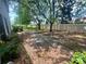 Spacious backyard area featuring mature trees providing ample shade at 2242 Seven Oaks Dr, St Cloud, FL 34772