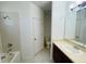 Bright bathroom featuring a shower-tub combo and vanity with sink at 2242 Seven Oaks Dr, St Cloud, FL 34772