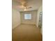 Cozy bedroom with neutral carpet, a ceiling fan and bright natural light at 2242 Seven Oaks Dr, St Cloud, FL 34772