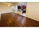 Open-concept living room and kitchen area with hardwood floors and lots of natural light at 2242 Seven Oaks Dr, St Cloud, FL 34772