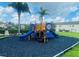 Community playground with colorful play structure and safety surfacing at 2242 Seven Oaks Dr, St Cloud, FL 34772
