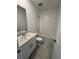 Bright bathroom featuring a single vanity, toilet, and a shower-tub combination at 2505 Merseyside Ct, Haines City, FL 33844