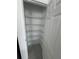 Well-organized closet with multiple shelves, providing ample storage space for clothes and accessories at 2505 Merseyside Ct, Haines City, FL 33844