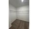 Compact walk-in closet with wire shelving and plush carpeting at 2505 Merseyside Ct, Haines City, FL 33844