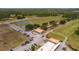 Golf course aerial featuring parking, tennis courts, and beautiful greens at 2580 Gallardia Dr, Lake Wales, FL 33898