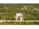 Aerial view of a new home nestled among trees, showcasing the property's setting at 2580 Gallardia Dr, Lake Wales, FL 33898