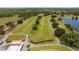 Expansive golf course aerial showcasing fairways, trees, and the clubhouse at 2580 Gallardia Dr, Lake Wales, FL 33898