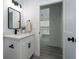 Modern bathroom with a single vanity, quartz countertops, and sleek black hardware at 2580 Gallardia Dr, Lake Wales, FL 33898