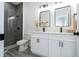 Modern bathroom with dual sinks, quartz countertops, a sleek shower, and black hardware at 2580 Gallardia Dr, Lake Wales, FL 33898