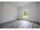Bright bedroom features a large window and neutral color palette, offering a serene and inviting space at 2580 Gallardia Dr, Lake Wales, FL 33898