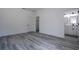 Neutral bedroom featuring gray vinyl floors and a closet adjacent to an ensuite bath at 2580 Gallardia Dr, Lake Wales, FL 33898