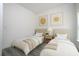 Charming bedroom featuring hardwood floors, neutral decor, and twin beds at 2580 Gallardia Dr, Lake Wales, FL 33898