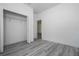 Neutral bedroom with gray floors and walk in closet at 2580 Gallardia Dr, Lake Wales, FL 33898
