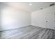 Bedroom featuring gray wood-look flooring and a door for privacy at 2580 Gallardia Dr, Lake Wales, FL 33898
