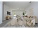 Bright living room boasts neutral tones, modern decor, and plenty of space for relaxation and entertaining at 2580 Gallardia Dr, Lake Wales, FL 33898