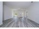 Bright, open living room with light gray flooring and a neutral color palette offers a modern, spacious feel at 2580 Gallardia Dr, Lake Wales, FL 33898