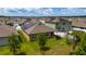 Backyard view of single Gathering home featuring solar panels, grill and back patio at 2726 Harmonia Hammock Rd, Harmony, FL 34773