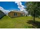 Expansive backyard features lush lawn, barbecue area, and white privacy fence for outdoor living and entertaining at 2726 Harmonia Hammock Rd, Harmony, FL 34773