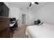 Bedroom featuring a bed, workspace, TV, and neutral decor at 2726 Harmonia Hammock Rd, Harmony, FL 34773
