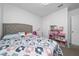 Bright bedroom with large bed and playhouse, filled with natural light at 2726 Harmonia Hammock Rd, Harmony, FL 34773