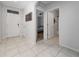 Bright open foyer with tile flooring, white walls, and an entryway to other rooms at 2726 Harmonia Hammock Rd, Harmony, FL 34773