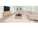 Open-concept living area with bright interior, seamlessly connecting the living room and dining space at 2860 Poppy Avenue, Haines City, FL 33844