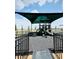 Fenced community playground with colorful play structure and safety surfacing, ideal for Gathering fun at 2860 Poppy Avenue, Haines City, FL 33844