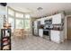 Bright and airy kitchen features stainless steel appliances, and a charming breakfast nook with lots of windows at 2926 Dickens Cir, Kissimmee, FL 34747