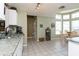 Well-lit kitchen area with sink, and adjacent breakfast nook with large windows at 2926 Dickens Cir, Kissimmee, FL 34747