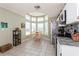 Bright and airy kitchen features stainless steel appliances, and a charming breakfast nook with lots of windows at 2926 Dickens Cir, Kissimmee, FL 34747
