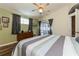 Lovely main bedroom featuring vaulted ceilings, wood-look floors, and a sunny window at 2926 Dickens Cir, Kissimmee, FL 34747
