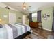 Spacious main bedroom featuring vaulted ceilings, wood-look floors, and ample closet space at 2926 Dickens Cir, Kissimmee, FL 34747