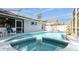 Inviting pool and spa area with a screened enclosure, providing the ultimate outdoor experience at 2926 Dickens Cir, Kissimmee, FL 34747