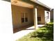 Covered back porch with outdoor lighting at 3074 Bay Laurel N Cir, Kissimmee, FL 34744