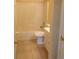 Bathroom featuring a shower-tub combo and tiled flooring at 3074 Bay Laurel N Cir, Kissimmee, FL 34744