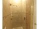 The tiled walk-in shower features glass door and fixtures at 3074 Bay Laurel N Cir, Kissimmee, FL 34744