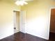 Bedroom featuring wood flooring and a ceiling fan at 3074 Bay Laurel N Cir, Kissimmee, FL 34744
