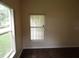 Bright bedroom with hardwood floors and a large window providing plenty of natural light at 3074 Bay Laurel N Cir, Kissimmee, FL 34744