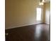 Primary bedroom features wood flooring and a bright window at 3074 Bay Laurel N Cir, Kissimmee, FL 34744