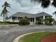 Community clubhouse with ample parking and lush landscaping at 3074 Bay Laurel N Cir, Kissimmee, FL 34744