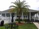 Community clubhouse with picnic tables, palm trees and lush landscaping at 3074 Bay Laurel N Cir, Kissimmee, FL 34744