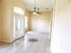 Bright entryway featuring tile flooring, a decorative medallion and a glass front door and sidelights allowing ample natural light at 3074 Bay Laurel N Cir, Kissimmee, FL 34744
