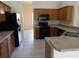 Efficient kitchen with a suite of matching appliances and ample counter space for cooking at 3074 Bay Laurel N Cir, Kissimmee, FL 34744