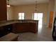 Functional kitchen featuring ample counter space, matching appliances, and neutral tile flooring at 3074 Bay Laurel N Cir, Kissimmee, FL 34744